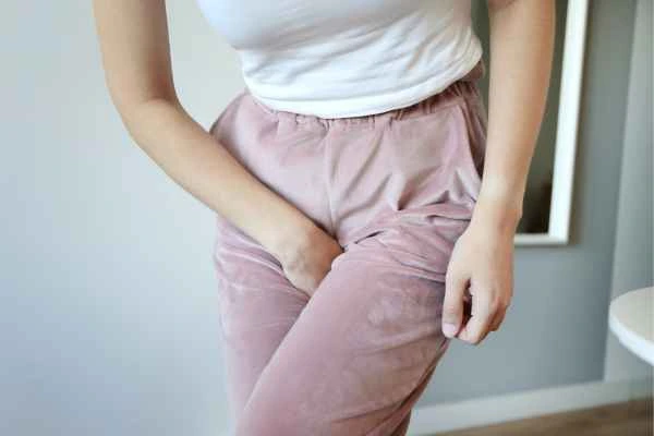 woman struggling with urine incontinence Custom House